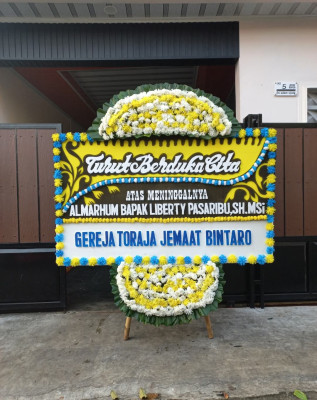 Papan Bunga Duka di Toyomerto